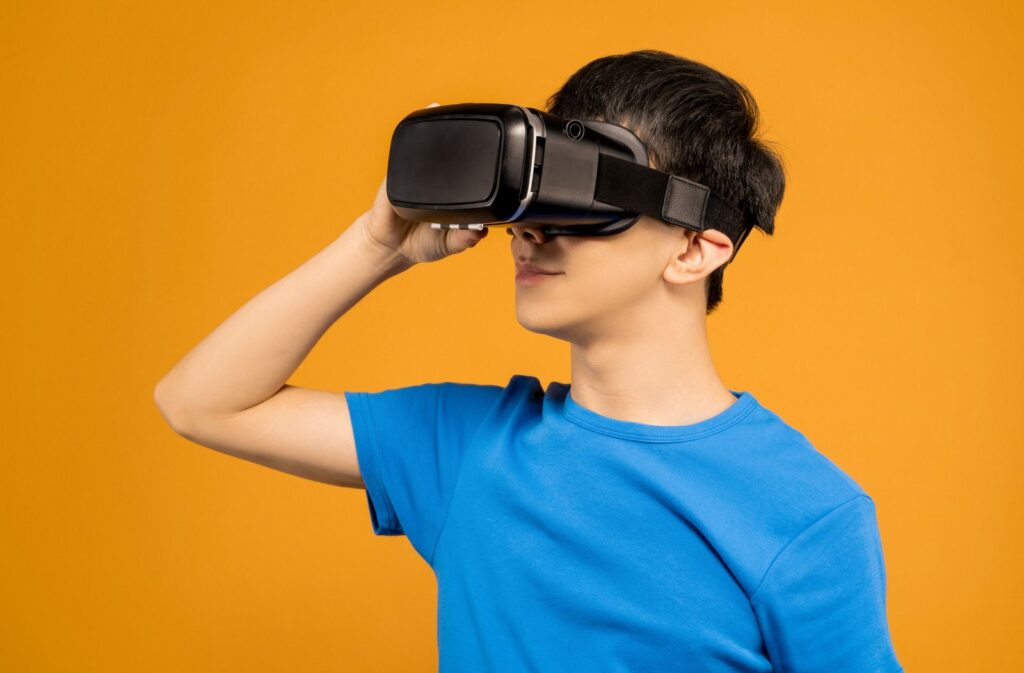 Student putting on a VR headset for a lesson powered by AI and extended reality