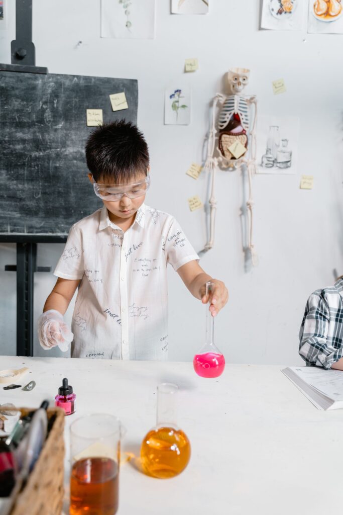 Student handling laboratory equipment after rehearsing in digital twin virtual labs