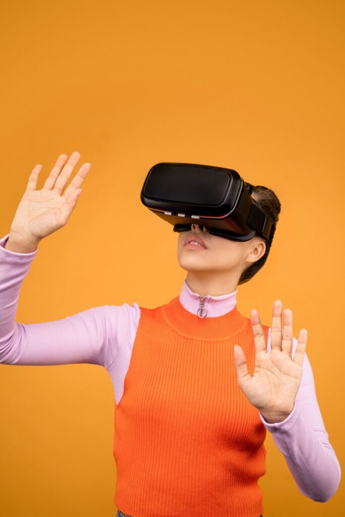 Student reaching out with both hands inside VR, practicing a skill with extended reality for immersive learning