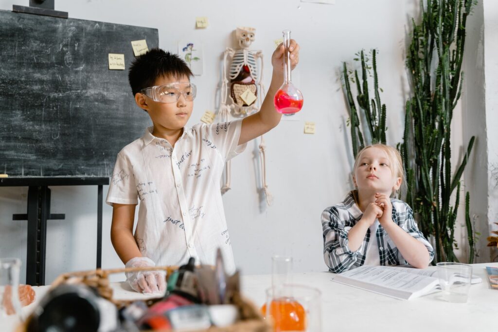 Students doing a chemistry experiment, a subject where extended reality in STEM education helps