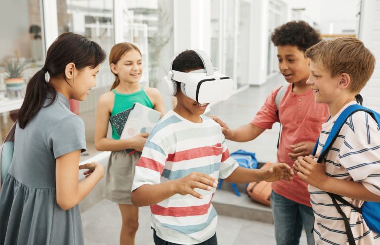 Students in a school corridor trying extended reality in STEM education with a VR headset