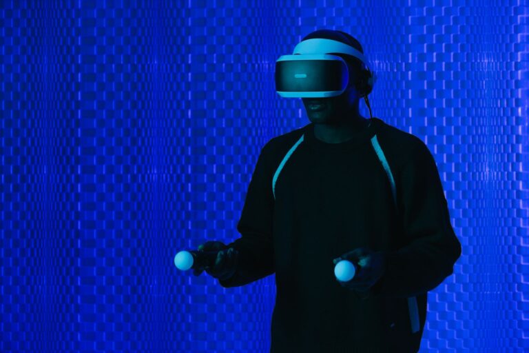 Person in a VR headset with controllers, used to compare extended reality vs virtual reality for learning