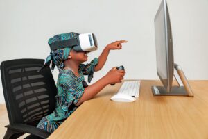 A child exploring a tablet, one of many immersive learning examples for schools