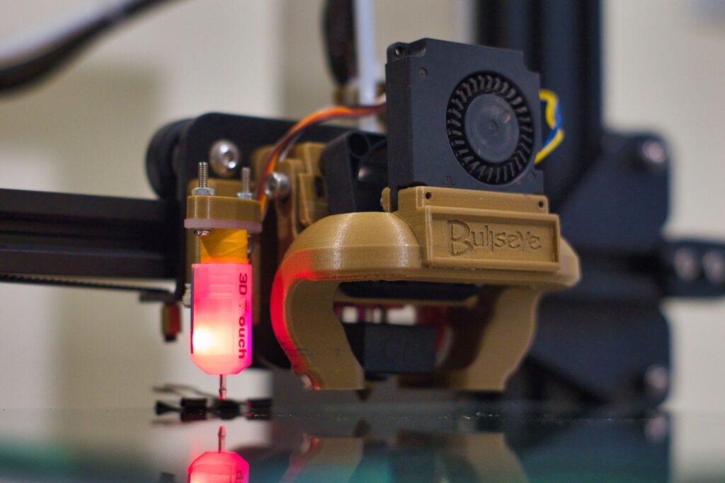 A 3D printer building a part in a workshop, an example of Industry 4.0 skills in action