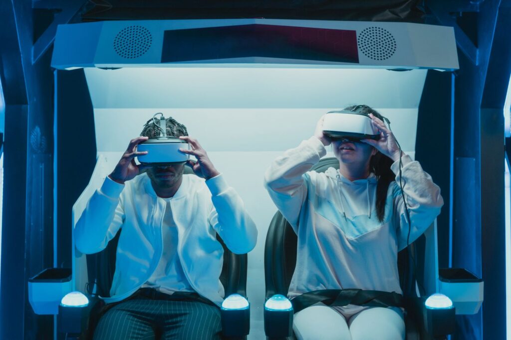 Two people wearing headsets side by side, a shared mixed reality in education experience