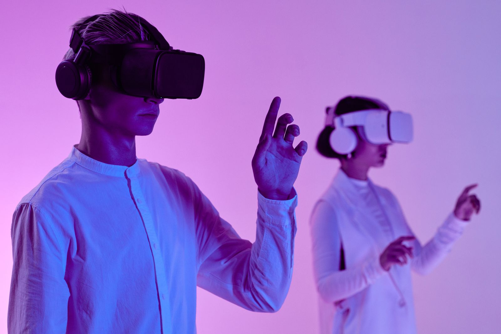 Two learners using headsets and hand gestures, showing mixed reality in education