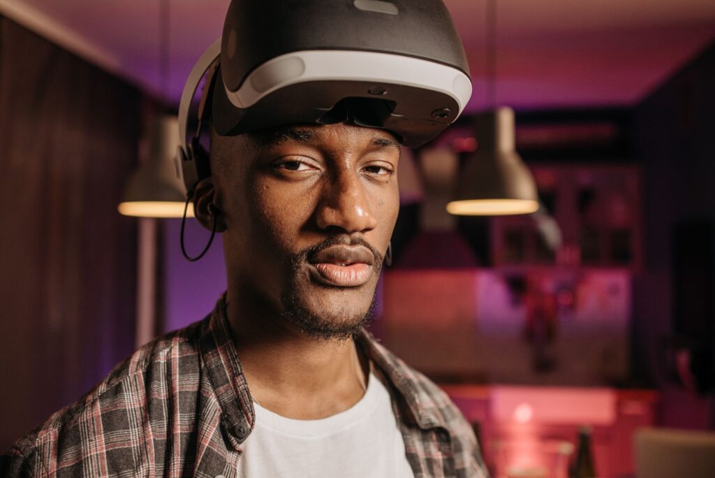 A student wearing a VR headset during a session in an XR lab for colleges