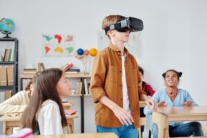 XR learning in a classroom with a student wearing a VR headset